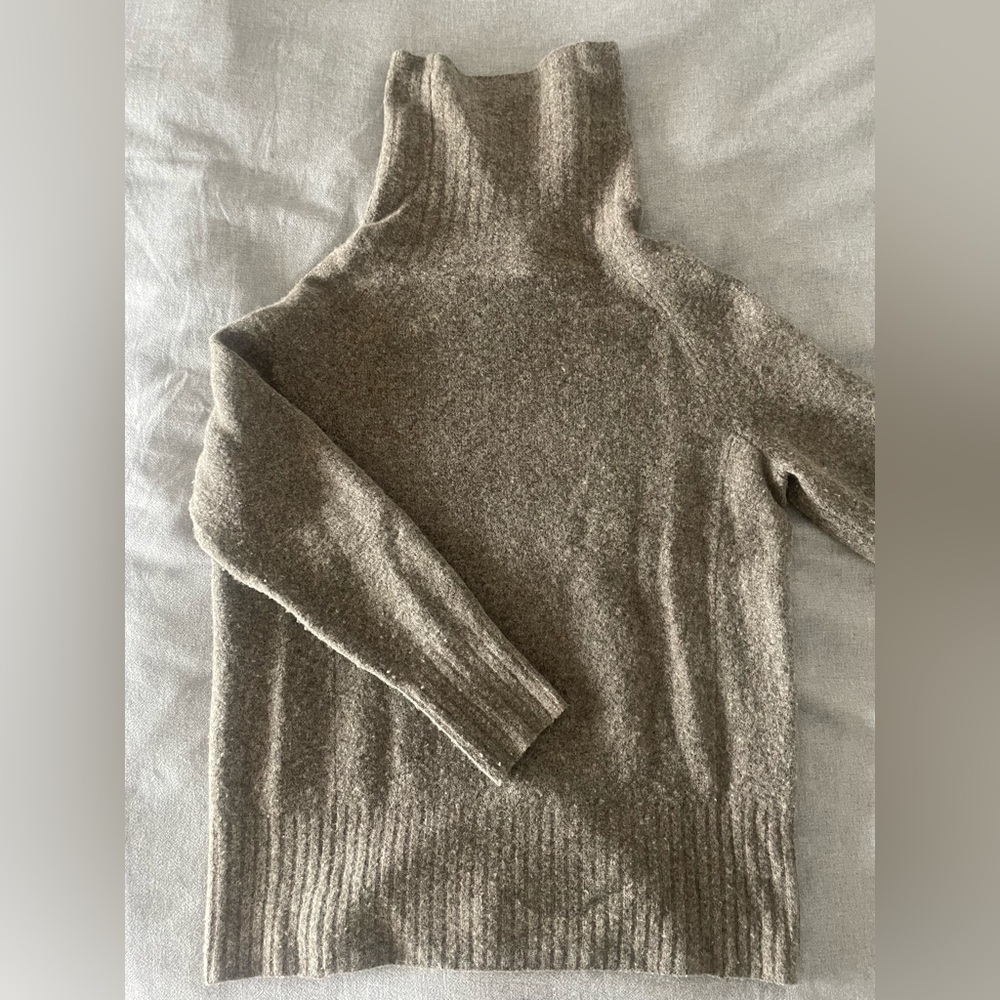The Group by Babaton funnel neck sweater.